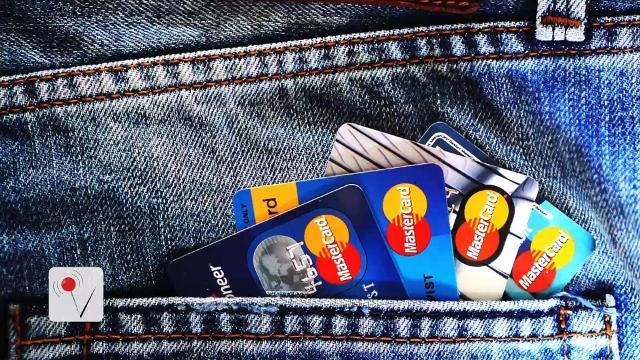 mastercards sticking out of someone's back pocket